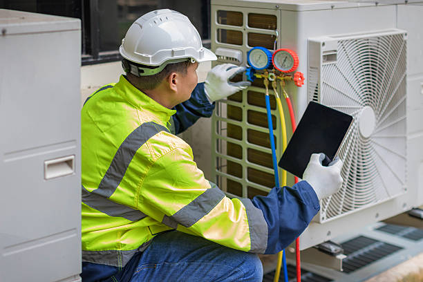 Professional Air Duct Cleaning technician working in Saint James, NY